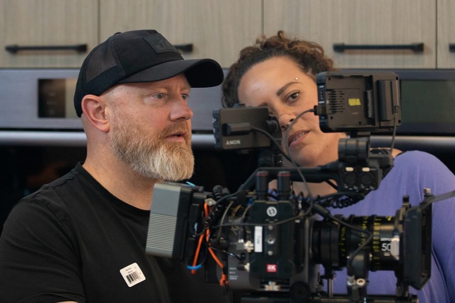 Camera operator and client checking the shot on the monitor