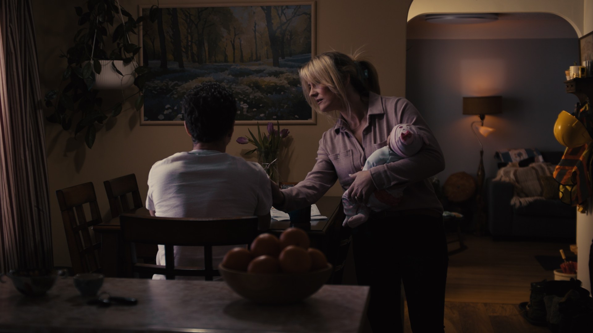 Flashback scene from the Tailgate Toolkit commercial — a family moment at home under strain
