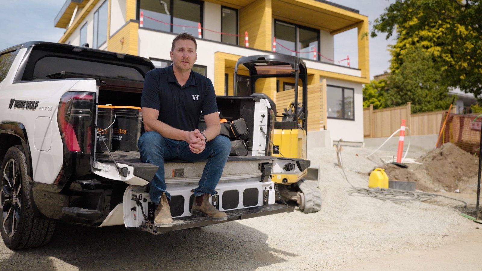 A business owner interviewed on the tailgate of his truck at a job site